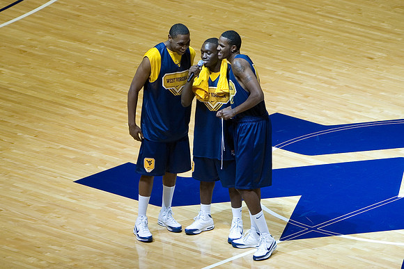 Jones, Truck, and Ebanks singing the National Anthem