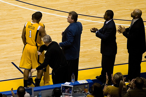 Assistant coach Billy Hahn prepares to give Butler his reward